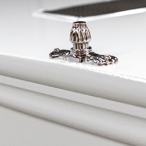 Chrome lid fitting on the moulded lid edge of The Kedleston, shown in white